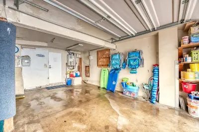 an empty garage with a bunch of gas tanks on the wall at Cute Home Steps from the Sand in San Diego