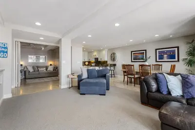 a living room with two couches and a dining room at Blue Horizon - SUR67 in Solana Beach