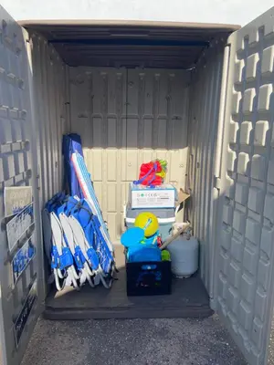 a baseball dugout with a bunch of equipment in it at Designer Home with Yard -Walk to Beach, Shops and More in Solana Beach