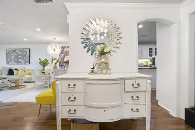 a white dresser in a living room with a mirror at Irvine Lake Forest Lake and Boat in Lake Forest
