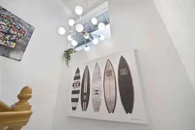 a picture of four surfboards hanging on a wall at Irvine Lake Forest Lake and Boat in Lake Forest