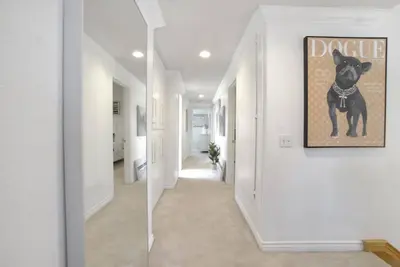 a hallway with a dog picture on the wall at Irvine Lake Forest Lake and Boat in Lake Forest