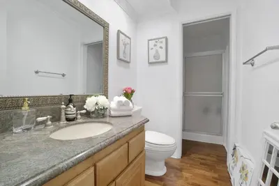 a bathroom with a sink and a toilet and a mirror at Irvine Lake Forest Lake and Boat in Lake Forest