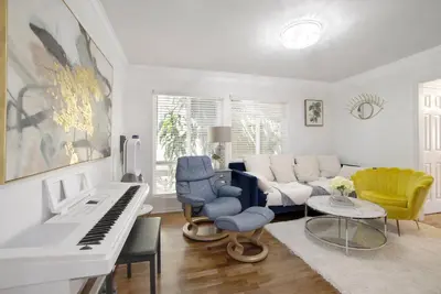 a living room with a piano and a couch at Irvine Lake Forest Lake and Boat in Lake Forest