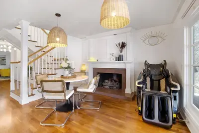 a living room with a fireplace and a table and chairs at Irvine Lake Forest Lake and Boat in Lake Forest