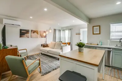 a kitchen and living room with a couch at Hip Walkable Neighborhood Condo in San Diego in San Diego