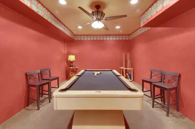 a room with a pool table and four chairs at Fairway Retreat, Stylish Coastal Home Near Golf, Beaches & Carlsbad Fun in Encinitas