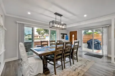 a dining room with a table and chairs at Luxury Beach Duplex, Sleeps 9, Dog-Friendly, AC, Fire Pit & Grill in Carlsbad