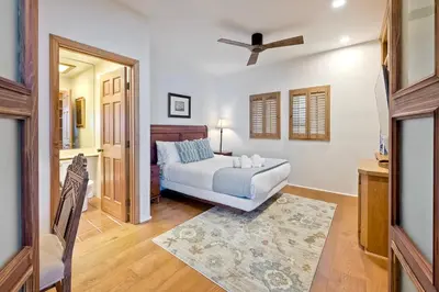 a bedroom with a bed and a ceiling fan at Direct Beach Access, Views, Carlsbad 2BR Upper Unit in Carlsbad