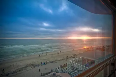 a view of the beach from a balcony at Direct Beach Access, Views, Carlsbad 2BR Upper Unit in Carlsbad