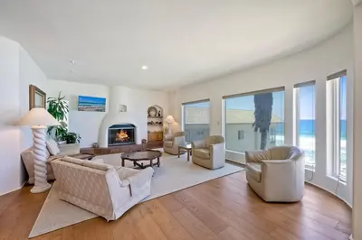 a living room filled with furniture and a fireplace at Direct Beach Access, Views, Carlsbad 2BR Upper Unit in Carlsbad