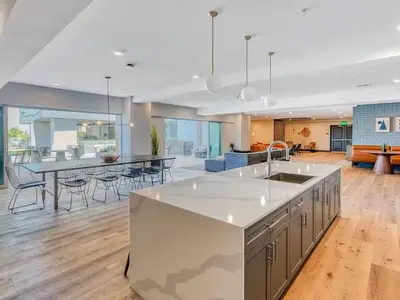 a kitchen and living room with a table and chairs at NEW LUX Modern Retreat Views Parking Workspaces in San Diego
