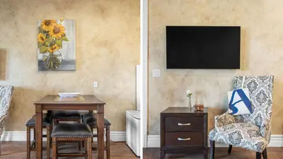 a living room with a table and a chair at 2 Homes in Bella Vista Rd by AvantStay Sleeps 8 Vineyard Views Patios in Temecula Wine Trail in Temecula