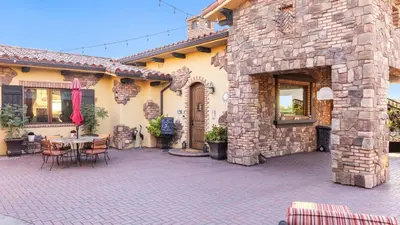 an outdoor patio with a table and chairs at Soaking Tub Vineyard Views Wine Trail Access The Casita at Vines Estate by AvantStay in Temecula