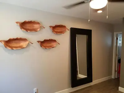 a wall with a mirror and a bunch of fish on it at The Hideaway in San Diego