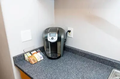 a coffee maker sitting on a counter in a room at Sutra in San Diego