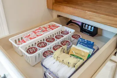 a drawer with several containers of food in a refrigerator at Canyon Treehouse in San Diego