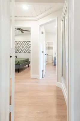 a hallway leading to a bedroom with a bed at Canyon Treehouse in San Diego