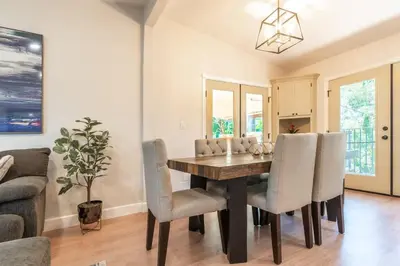 a dining room with a table and chairs at Canyon Treehouse in San Diego