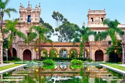 an old building with a pond in front of it at Canyon Treehouse in San Diego
