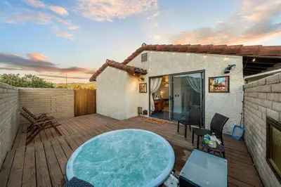 a hot tub sitting on a wooden deck at Entire Private Home with 3 Bedrooms 2 Bathrooms, Mountain View, Jetted Tub, 2500 sqft, King Bed,Garage, Available Now in Jamul