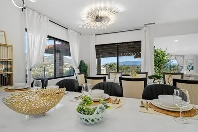 a dining room with a white table and chairs at Entire Private Home with 3 Bedrooms 2 Bathrooms, Mountain View, Jetted Tub, 2500 sqft, King Bed,Garage, Available Now in Jamul