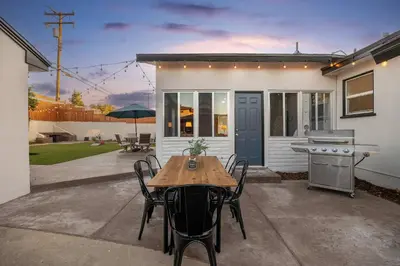 a table and chairs in front of a house at Central Backyard Oasis Villa in San Diego