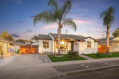 a house with a palm tree in the driveway at Central Backyard Oasis Villa in San Diego