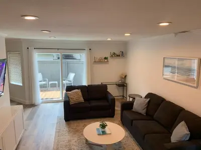 a living room with a couch and a table at Beautifully Remodeled 2BR Prime Irvine Location in Irvine