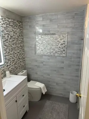 a bathroom with a toilet and a sink at Quail Hill Condo in Irvine