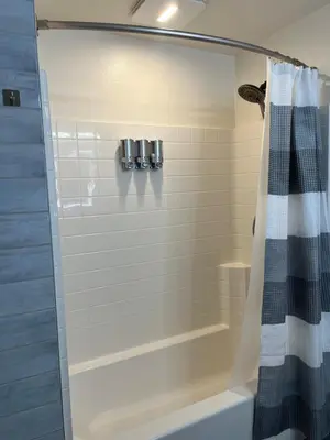 a bathroom with a shower with a shower curtain at Quail Hill Condo in Irvine