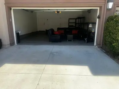an empty garage with a living room in it at Quail Hill Condo in Irvine