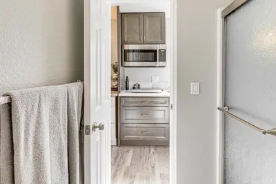 a kitchen with a sink and a microwave at Pool Access and Private Deck Mtn-View Bonita Studio in Bonita