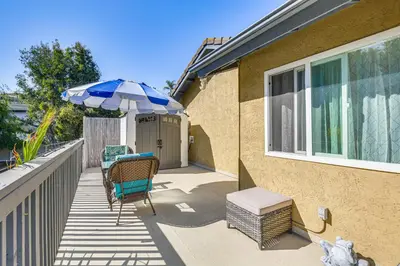 a patio with an umbrella and a table and chairs at Pool Access and Private Deck Mtn-View Bonita Studio in Bonita