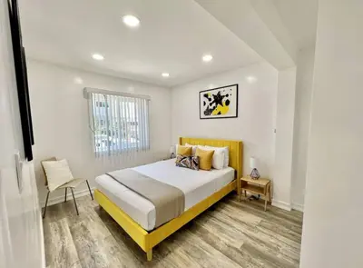 a bedroom with a large bed and a window at Central San Diego 2 BED Condo in San Diego