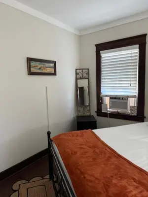 a bedroom with a bed and a window at Cozy cottage in San Diego