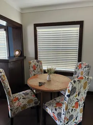 a room with a table and chairs and a window at Cozy cottage in San Diego