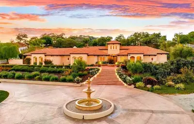 a house with a fountain in front of it at Luxury Estate Tucked Away in the Exclusive Area of Tenaja in Murrieta