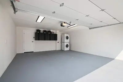 an empty room with a speaker and a washing machine at Renovated Coastal 2BR - Stylish & Bright in San Diego