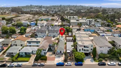 an aerial view of a residential neighborhood with a red marker at Renovated Coastal 2BR - Stylish & Bright in San Diego