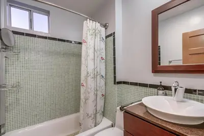 a bathroom with a sink and a toilet and a shower at 3BRB with Bonus Bedroom, Hot Tub, Tropical Oasis in San Diego