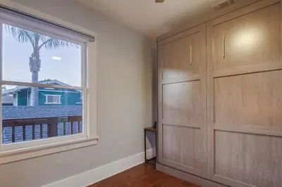 a room with a large window and a large closet at 3BRB with Bonus Bedroom, Hot Tub, Tropical Oasis in San Diego