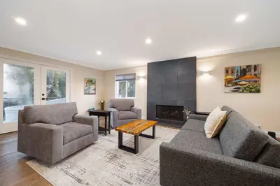 a living room with two couches and a fireplace at Luxury Home OceanView in San Diego