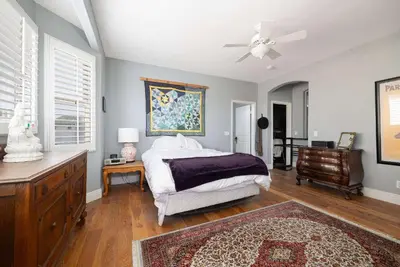 a bedroom with a bed and a ceiling fan at Prime Location Spacious townhome in San Diego