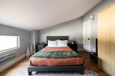 a bedroom with a bed and a window at Prime Location Spacious townhome in San Diego