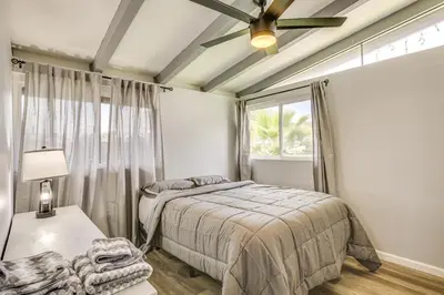 a bedroom with a bed and a window at 6 Mi to Pacific Beach Pet-Friendly San Diego Home in San Diego