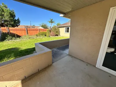 a porch of a house with a view of a yard at Family Fun Getaway - 3BR - Games - BBQ Patio in Santee