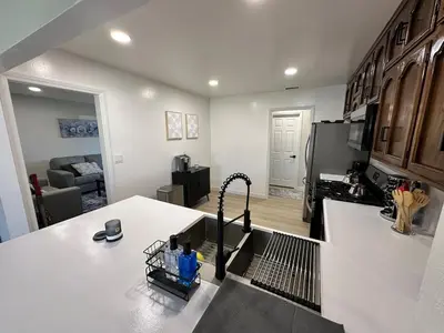a kitchen with a counter top with a stove top at Family Fun Getaway - 3BR - Games - BBQ Patio in Santee