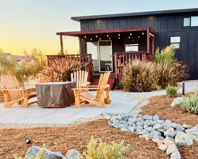 a patio with two chairs and a house at The Hilltop Haven - Romantic Getaway Suite in Temecula