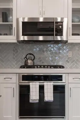 a kitchen with a stove with a tea kettle on it at Steps from Bay Ocean Villa in San Diego